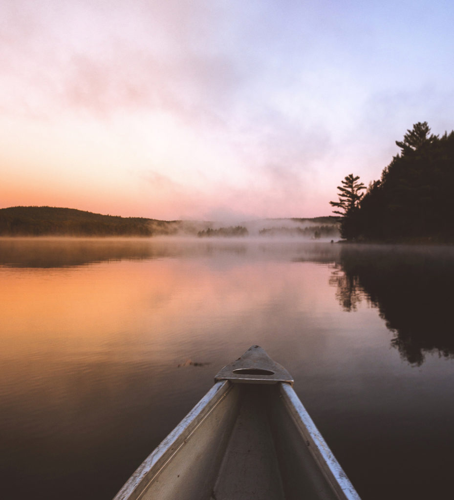 Sunrise in a canoe looking for bass.